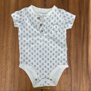 Blue and white print onesie with buttons
